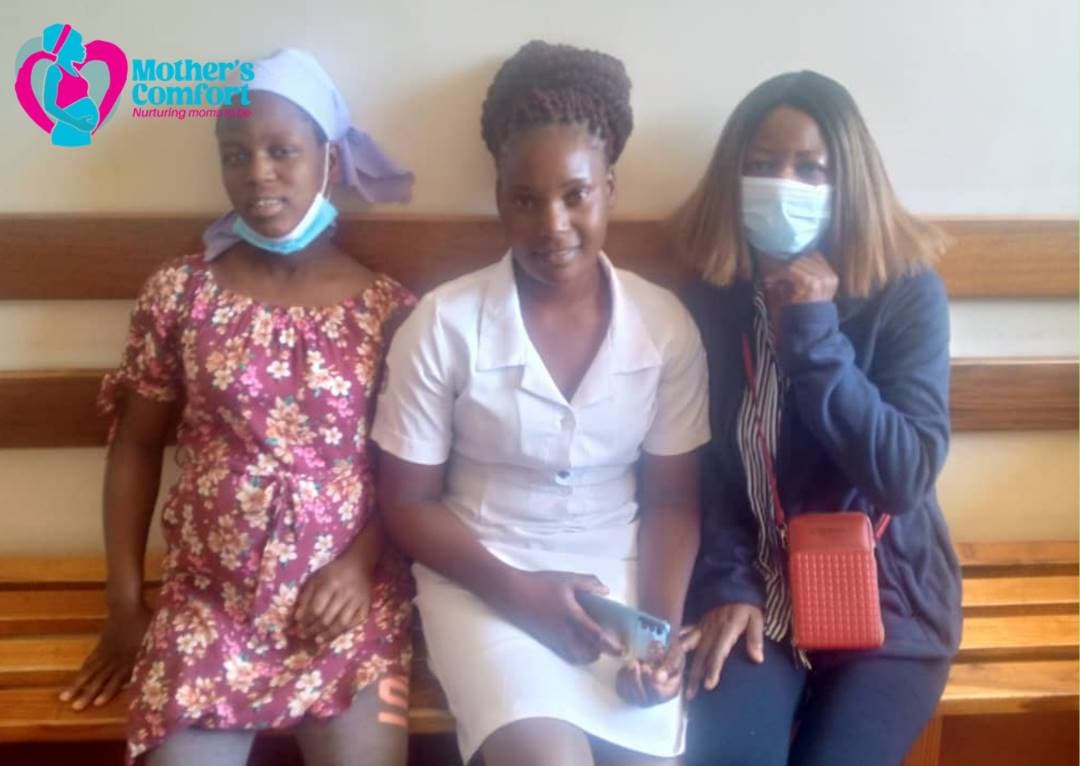 Mother's Comfort team with a mother at a clinic